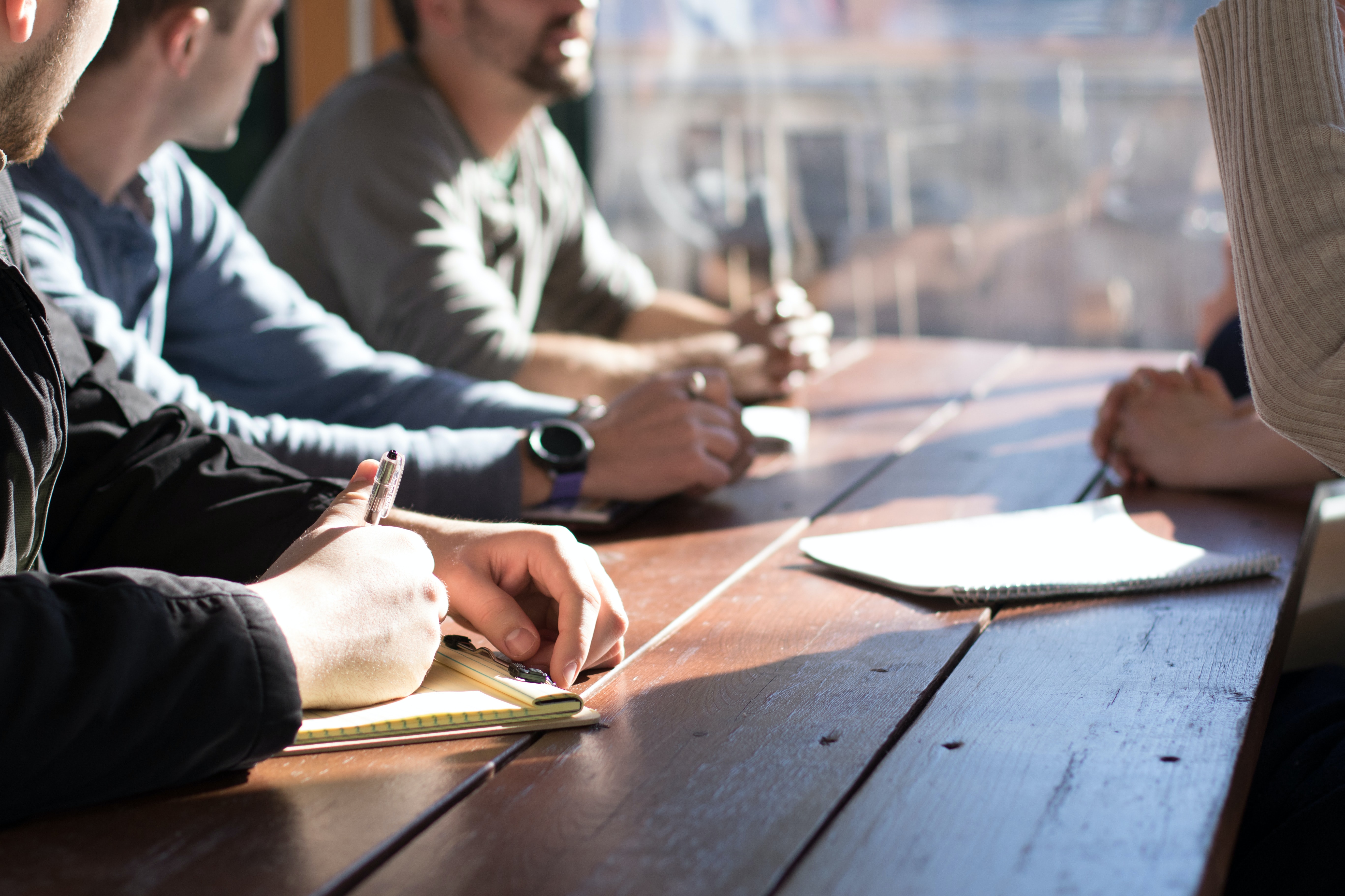 group of workers sitting around a table