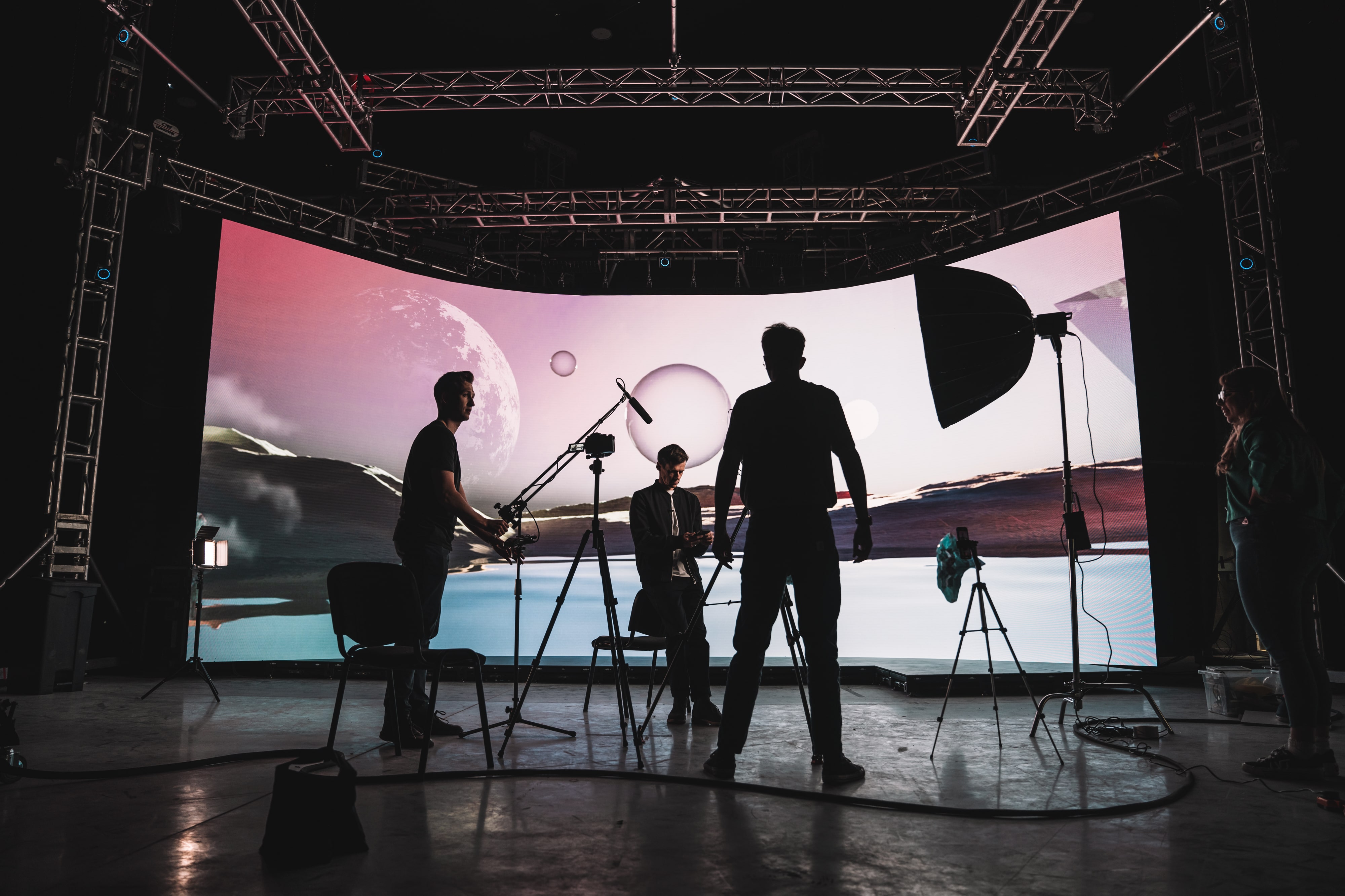 Camera crew works in a virtual production studio