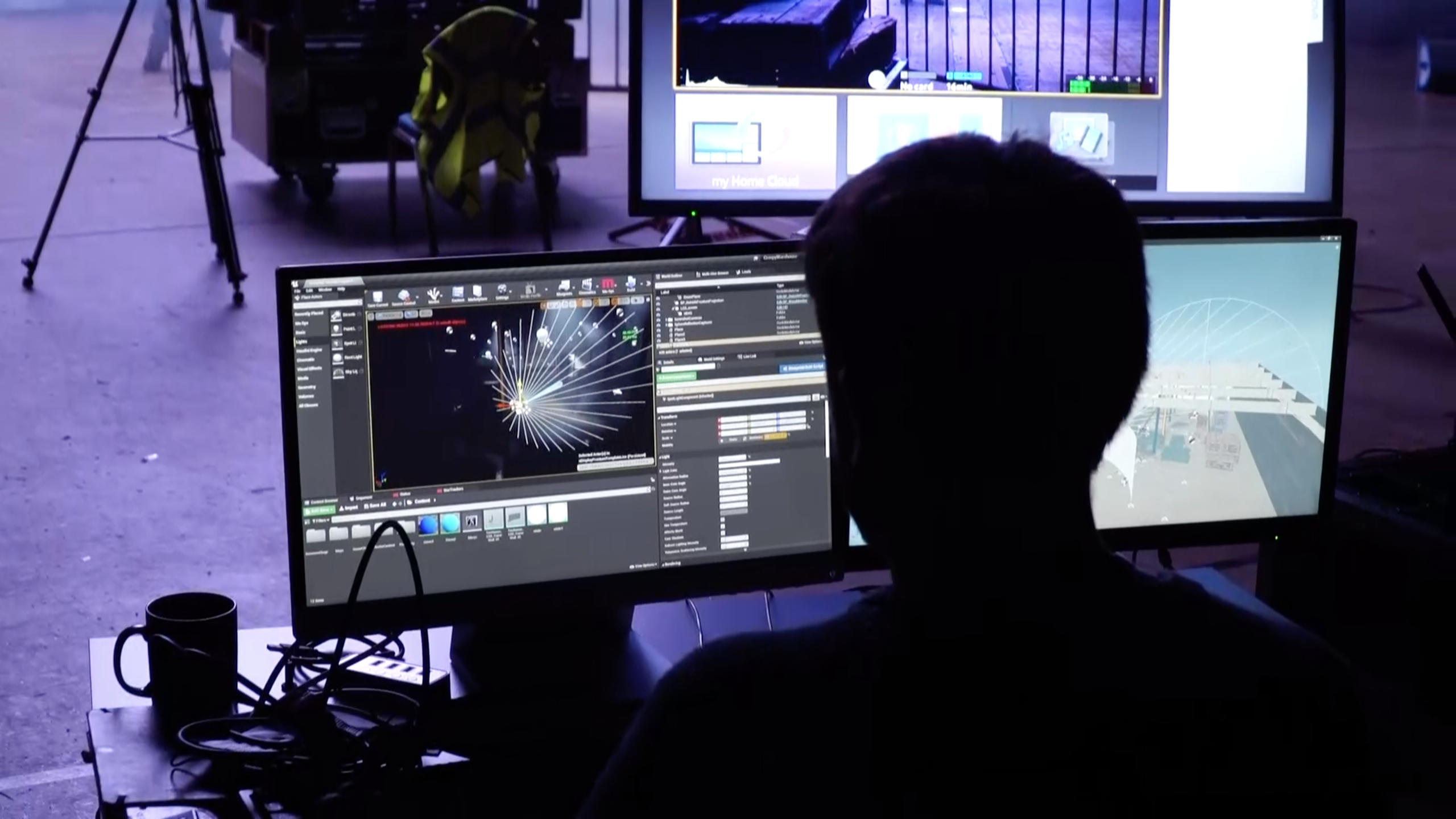 Professional working with a computer in a virtual production set