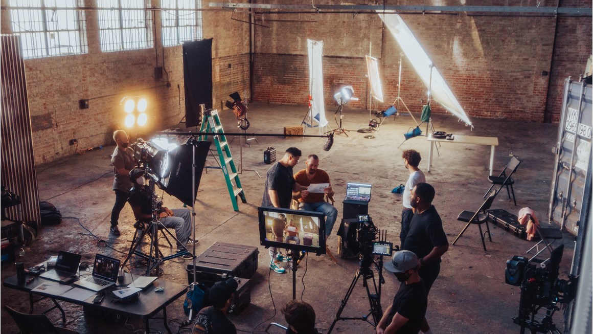Film/TV set from above showing people working with lighting and cameras