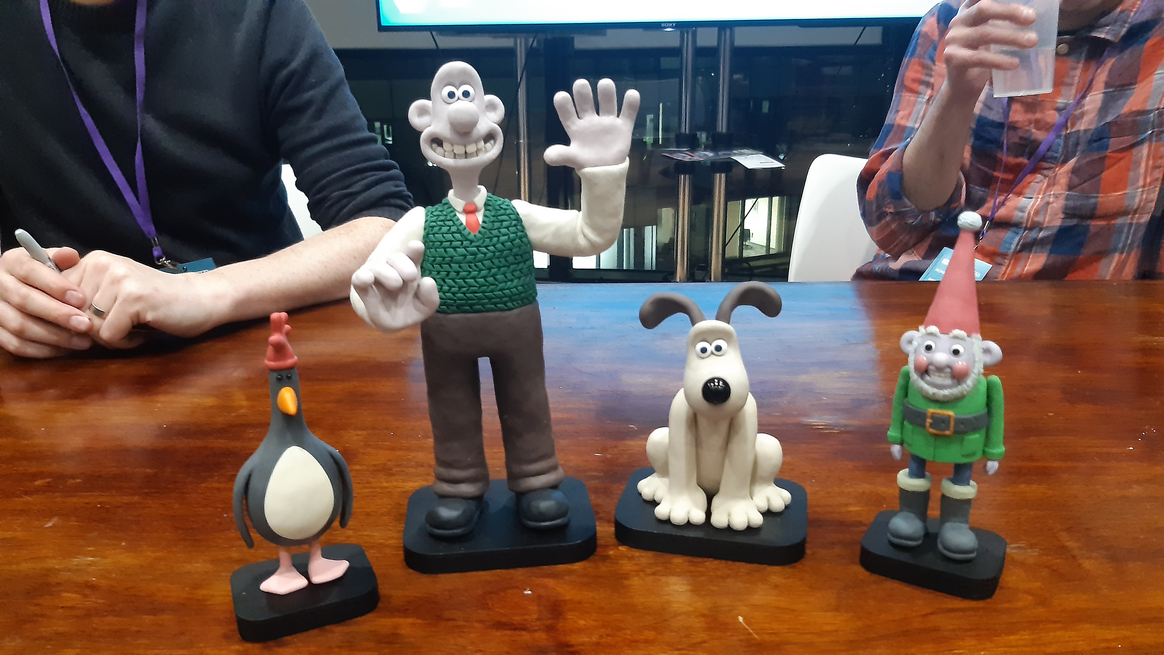 A selection of Wallace and Gromit characters on a table