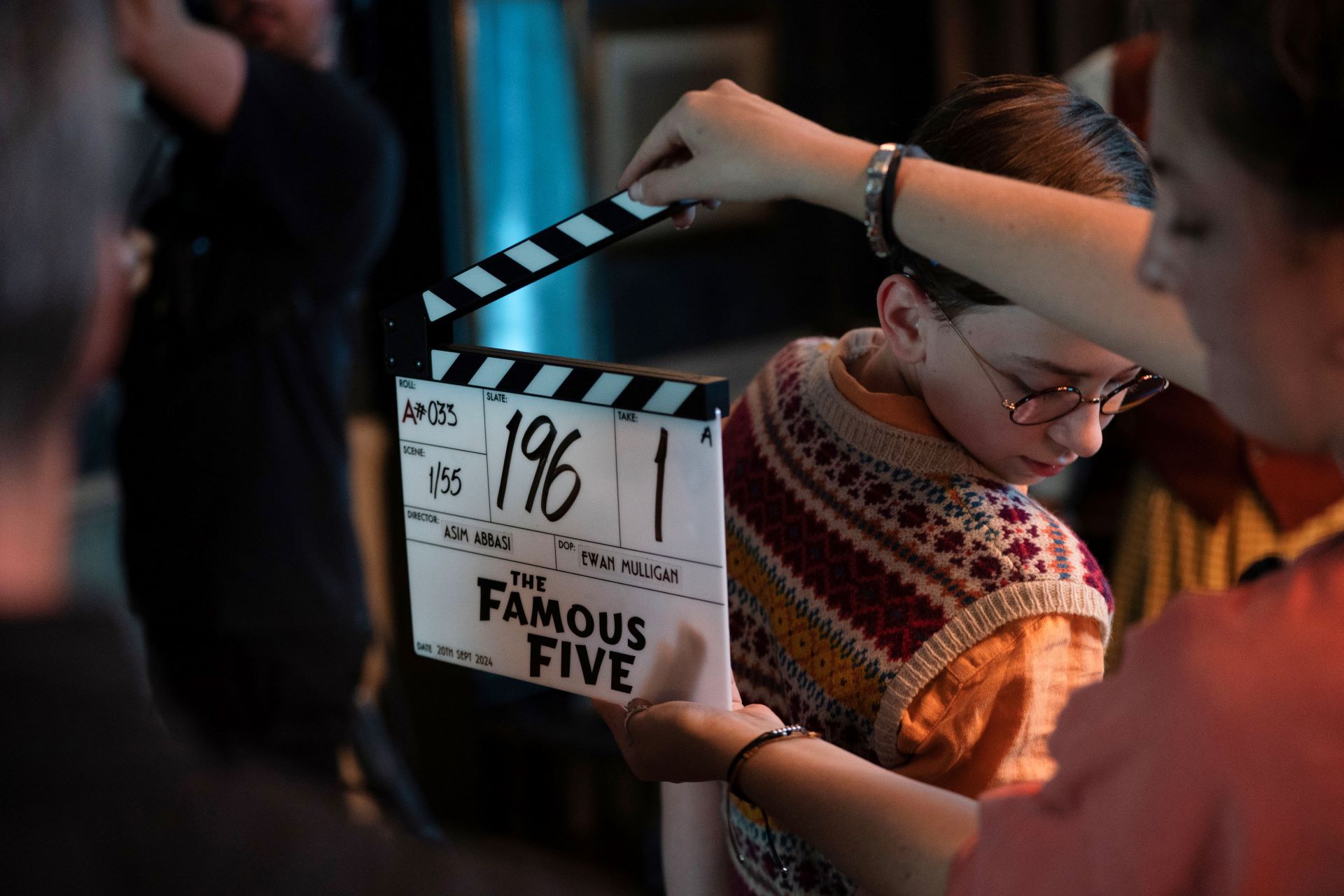 An image of someone holding a clapperboard on set of The Famous Five