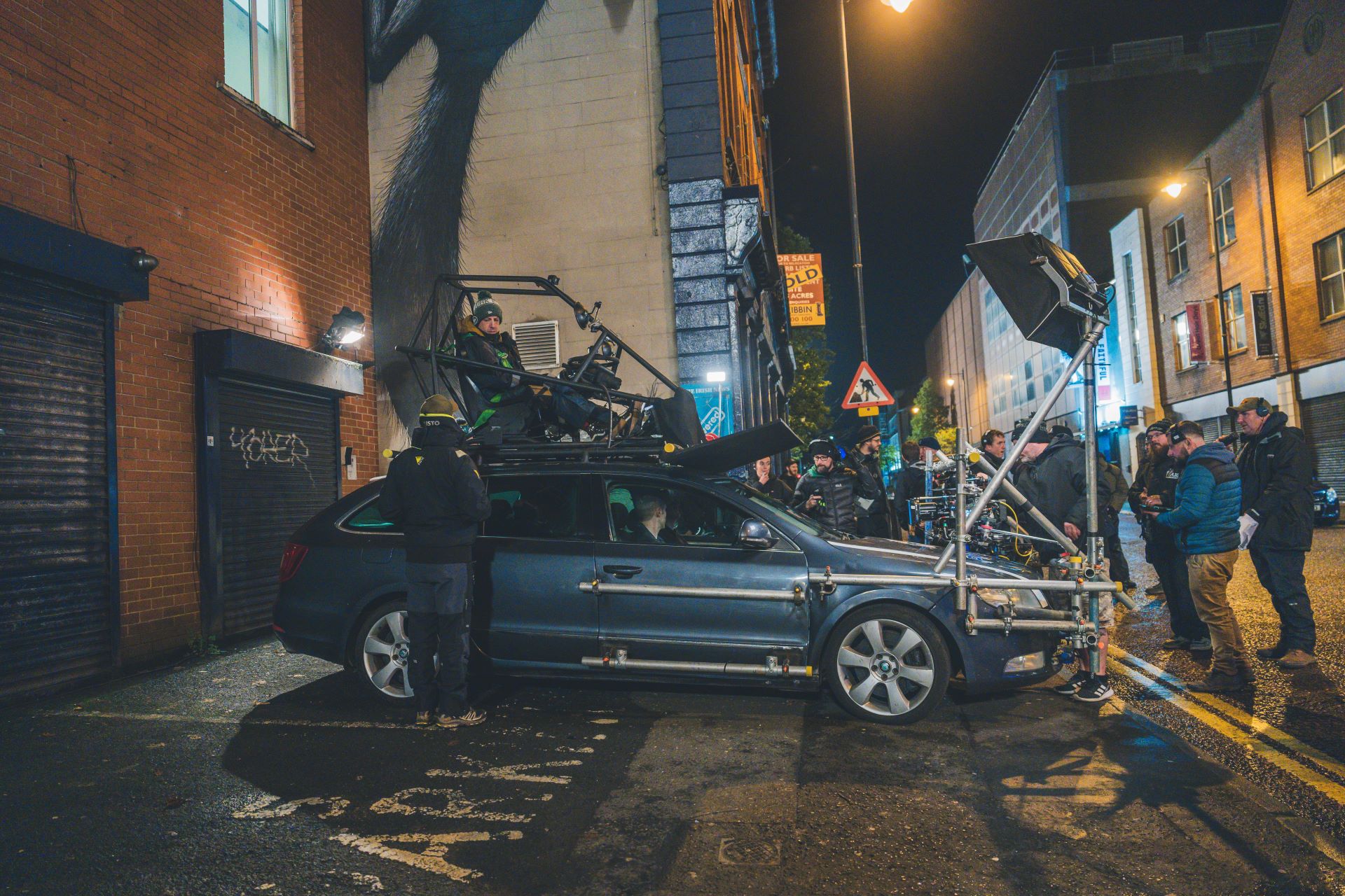 On location of Blue Lights season 2, production crew rig lights to film a car scene